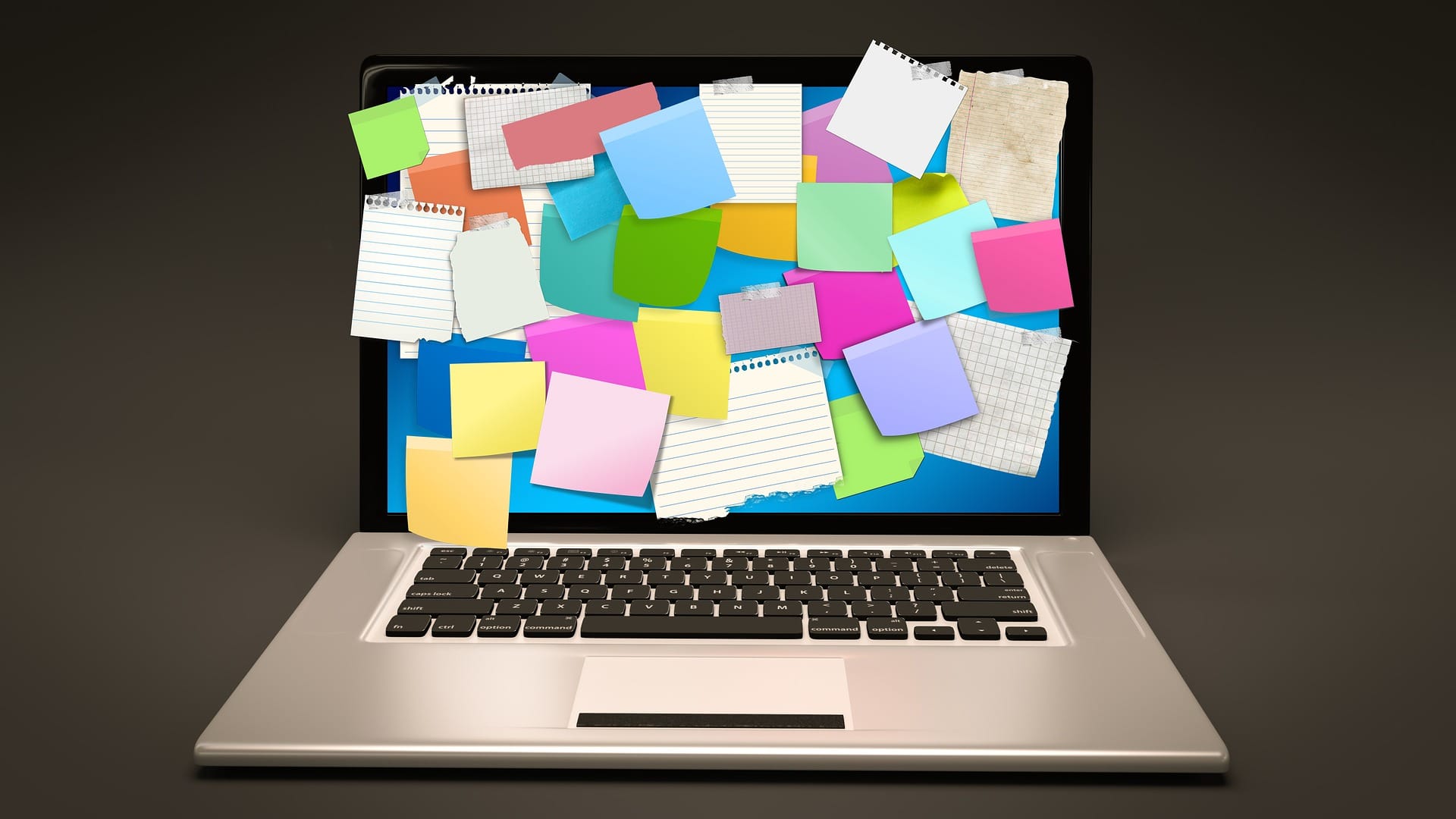Sticky notes covering a laptop screen