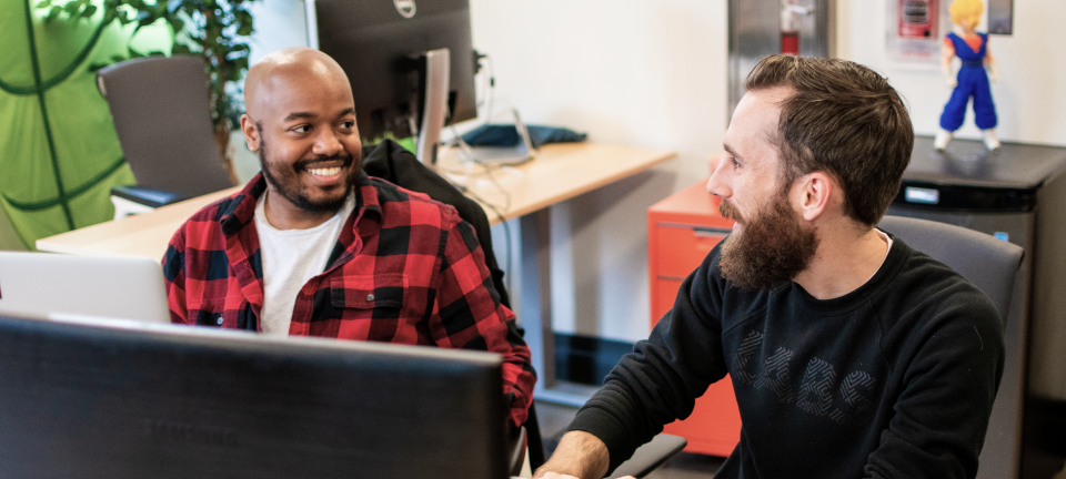 Two developers pairing through a problem together.