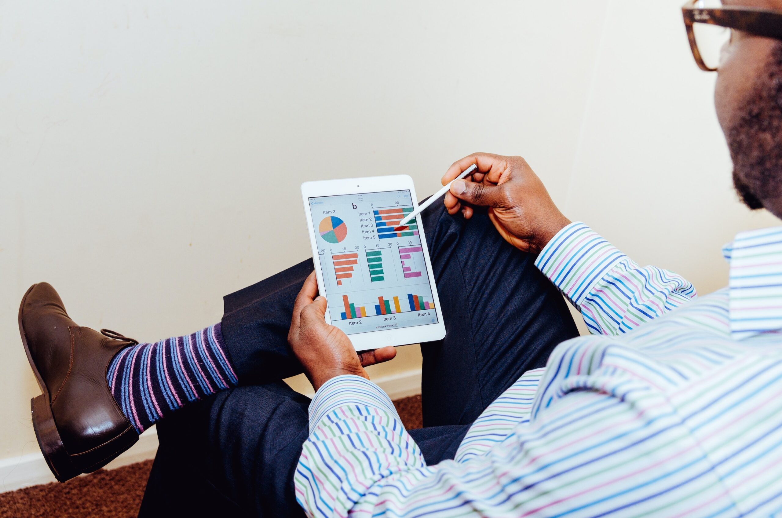 data to insight - man looking at tablet for business insights