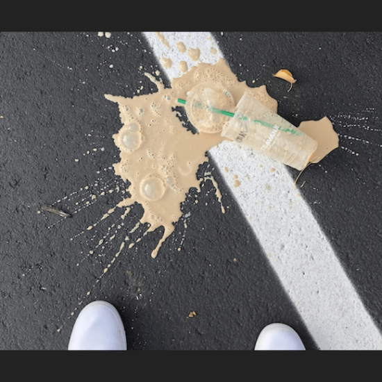 Starbucks coffee spilled on pavement