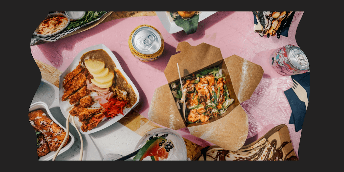 Takeout restaurant food and drinks on colorful table